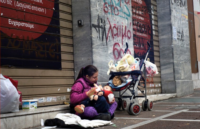 ATHENS, GREECE - FEBRUARY 18:  A mother with her baby begs at Stadiou street on Fenruary 18, 2013 in Athens, Greece.  The numbers of homeless in Athens is rising rapidly as businesses face bankruptcy and workers with work find themselves unable to pay their bills. Homelessness has soared by an estimated 25% since 2009 as Greece struggles to deal with the euro zone economic crisis. Greece is in its fifth year of recession and the official unemployment figures are rising towards 20%. Tensions between Greece and Germany are growing as Greeks struggle to deal with the austerity measures set in order for Greece to receive EU bailout money. (Photo by Milos Bicanski/Getty Images)